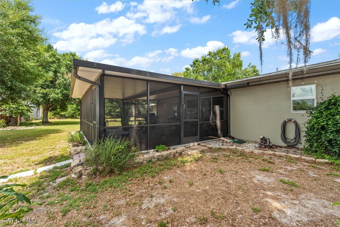 13951 Rod And Gun Club Road Fort Myers, FL 33913 - Photo 38 of 49 a backyard of a house with lots of green space