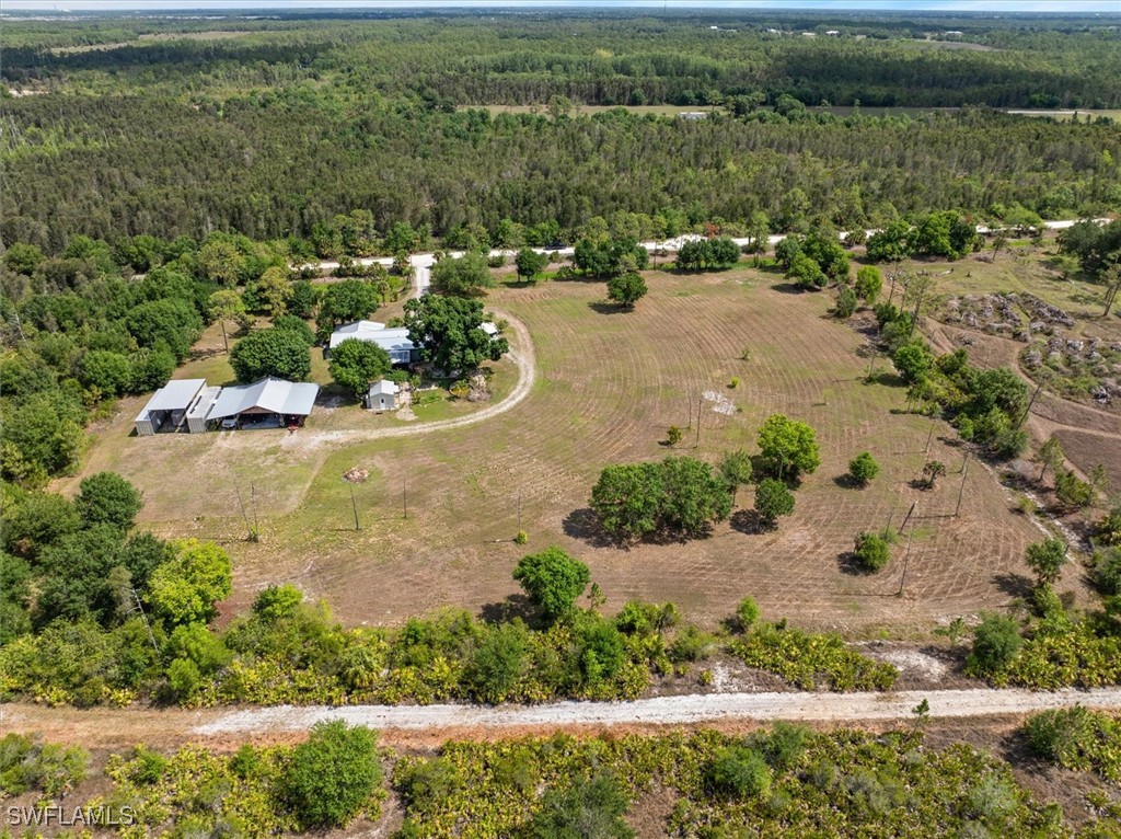 13951 Rod And Gun Club Road Fort Myers, FL 33913 - Photo 40 of 49 an aerial view of a house with a yard and lake view