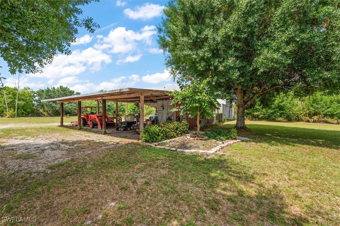 13951 Rod And Gun Club Road Fort Myers, FL 33913 - Photo 43 of 49 a view of outdoor space yard and patio