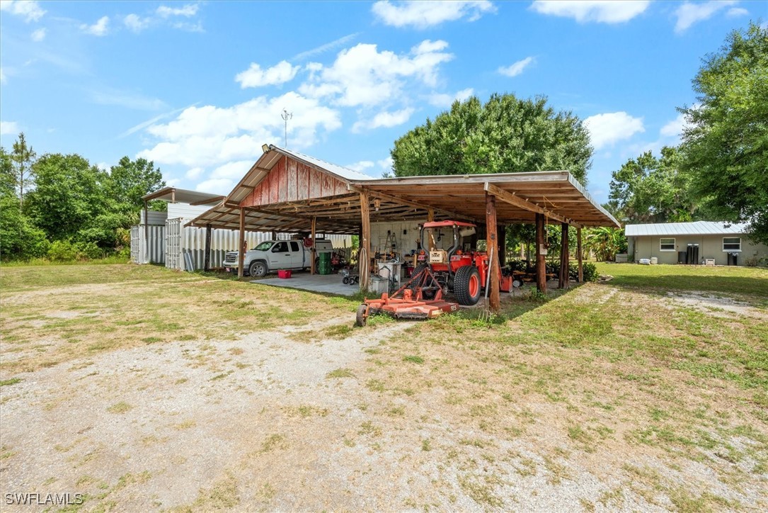 13951 Rod And Gun Club Road Fort Myers, FL 33913 - Photo 44 of 49 a view of a house with a patio
