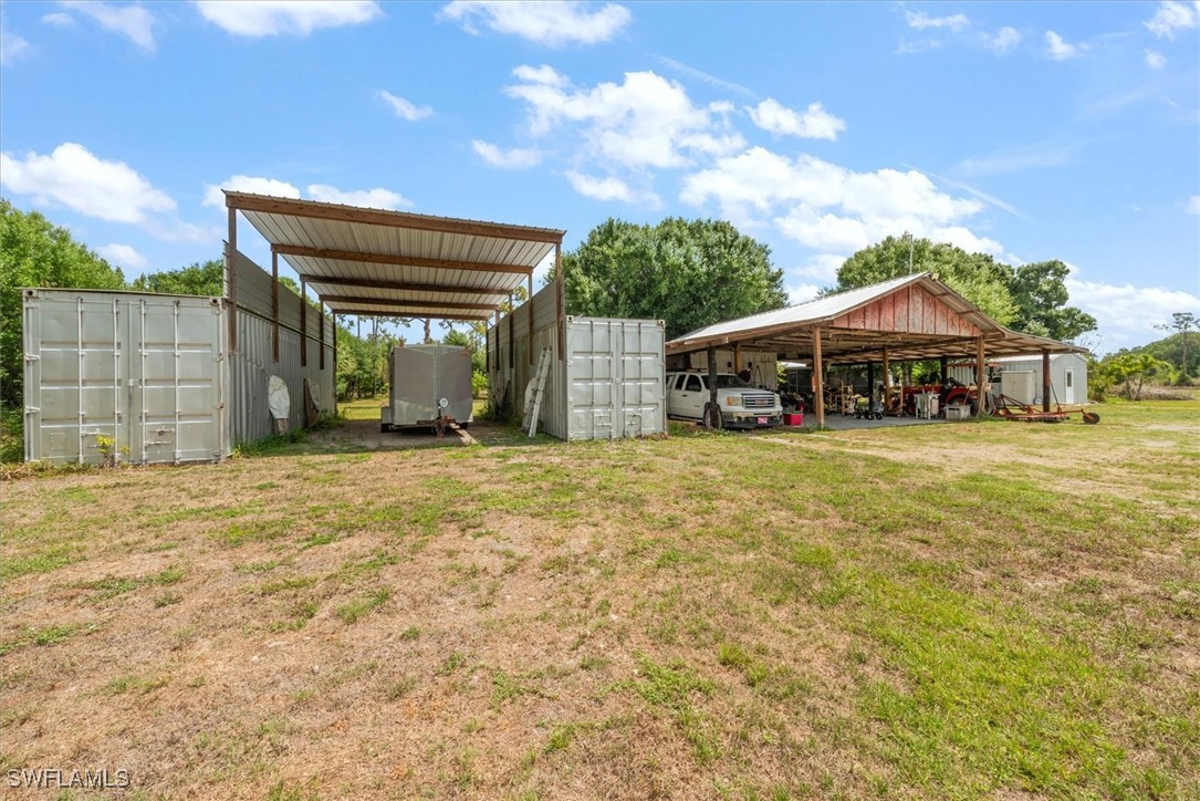 13951 Rod And Gun Club Road Fort Myers, FL 33913 - Photo 46 of 49 a front view of a house with a yard