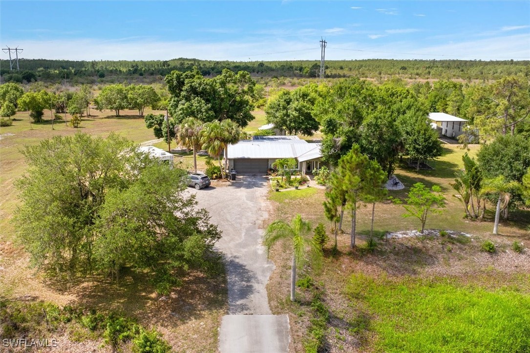 13951 Rod And Gun Club Road Fort Myers, FL 33913 - Photo 9 of 49 a view of a lake with a yard