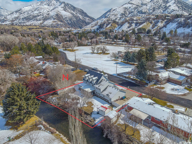 1045 Fox Farm Road Logan, UT 84321 - Photo 64 of 65 Snowy aerial view featuring a mountain view