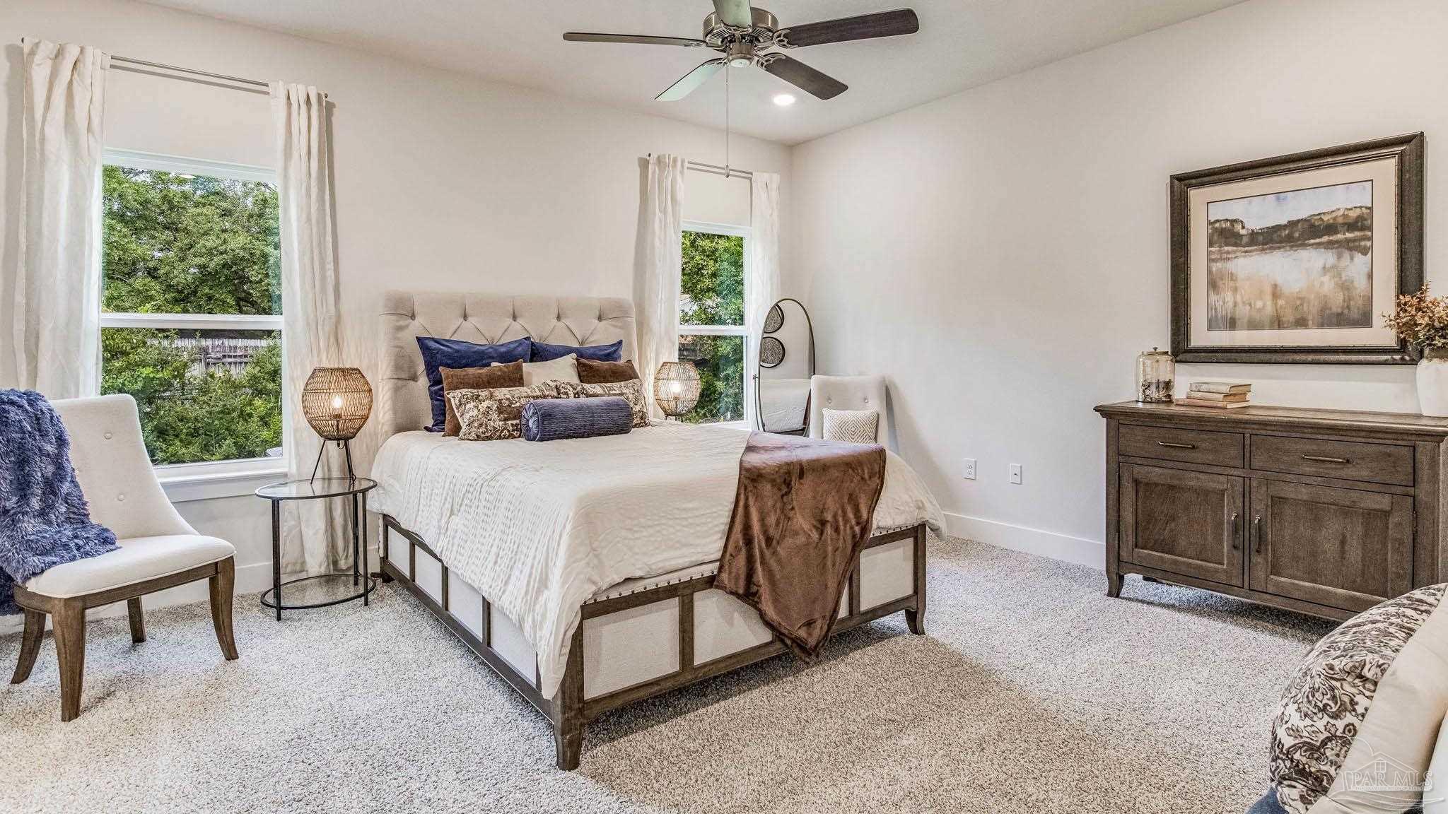 5856 Dove Nest Road Gulf Breeze, FL 32563 - Photo 14 of 33 a bed room with a bed and a fireplace