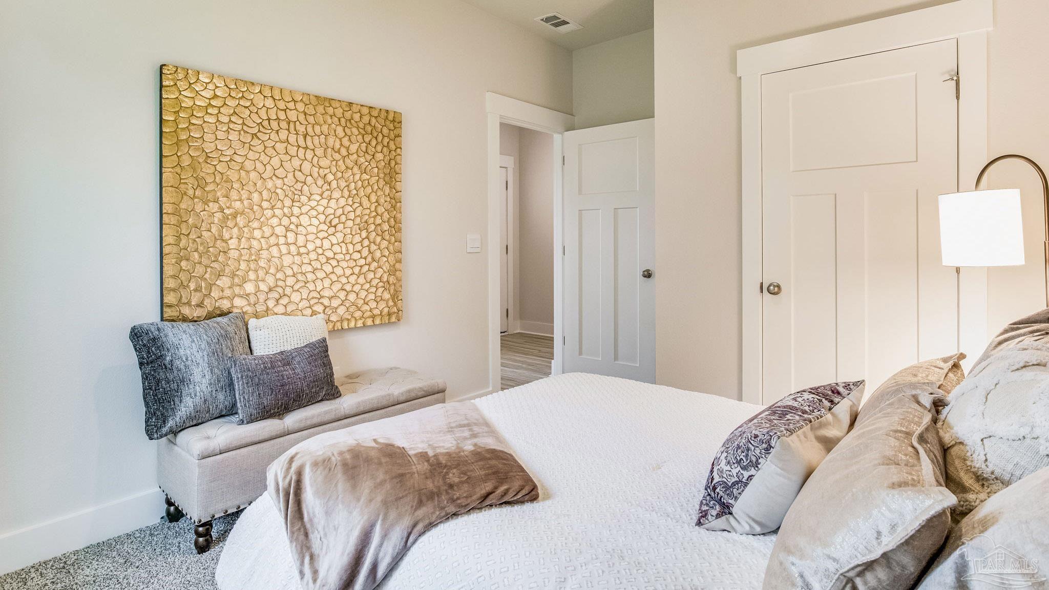 5856 Dove Nest Road Gulf Breeze, FL 32563 - Photo 29 of 33 a bedroom with a bed and a window