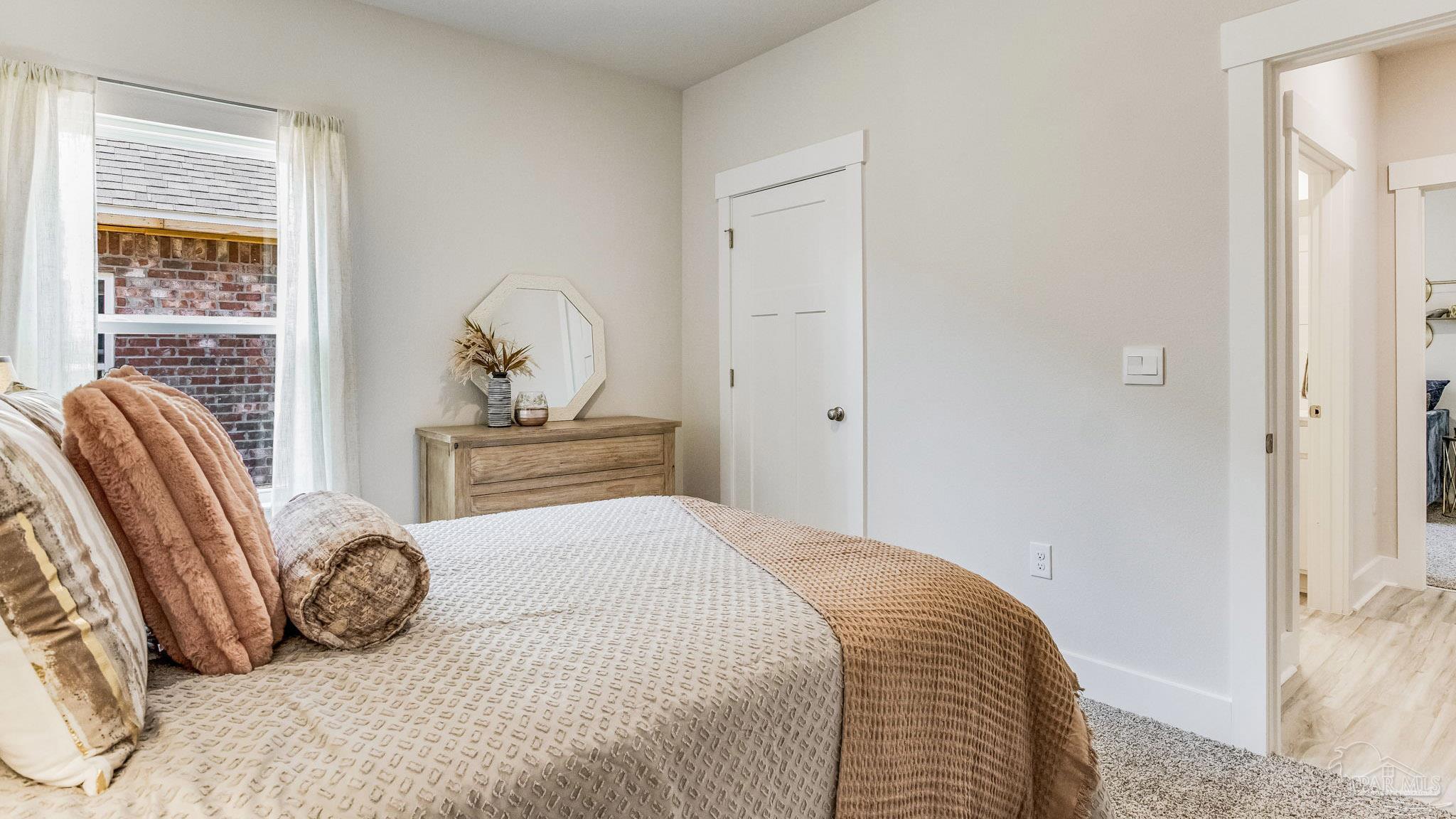 5856 Dove Nest Road Gulf Breeze, FL 32563 - Photo 33 of 33 a bedroom with a bed and wooden floor