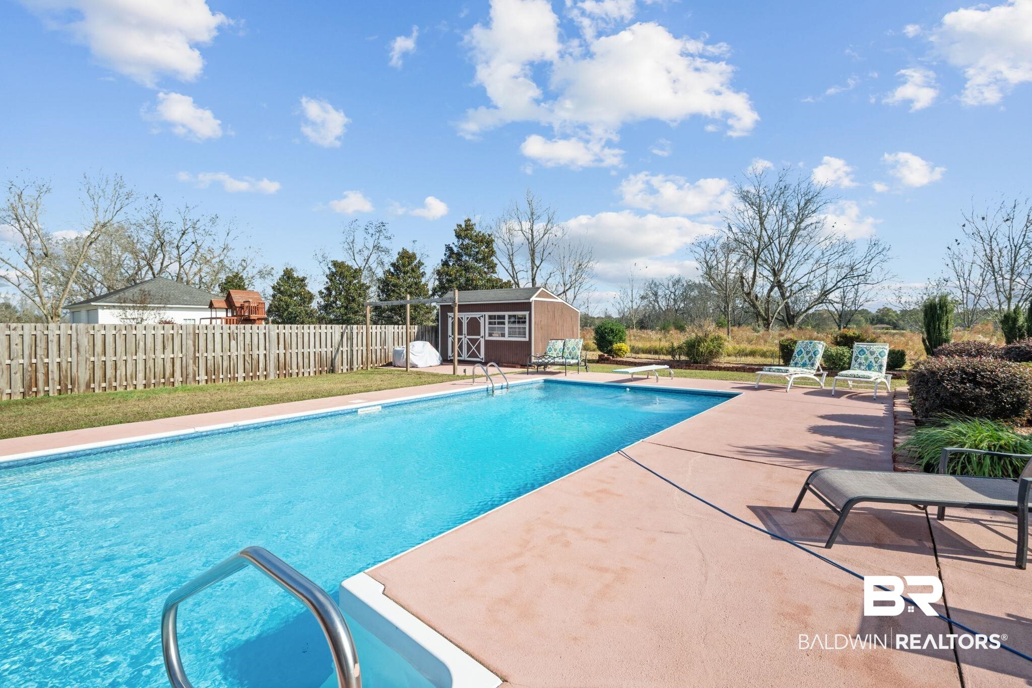 4771 Pecan Ridge East Mobile, AL 36619 - Photo 7 of 48 View of swimming pool with an outdoor structure, a patio, a fenced backyard, and a diving board