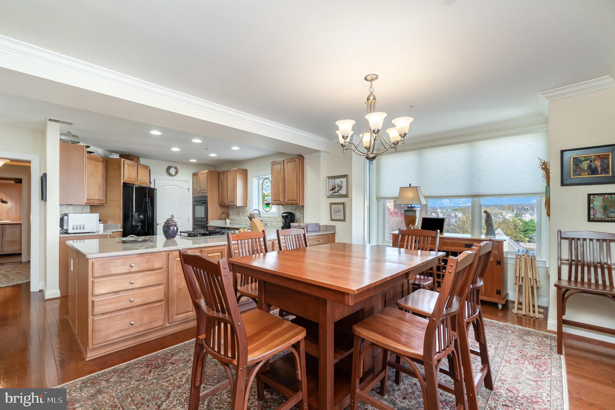 605 Concord Street, Unit 3E Havre de Grace, MD 21078 - Photo 12 of 59 a dining room with a wooden table and chairs