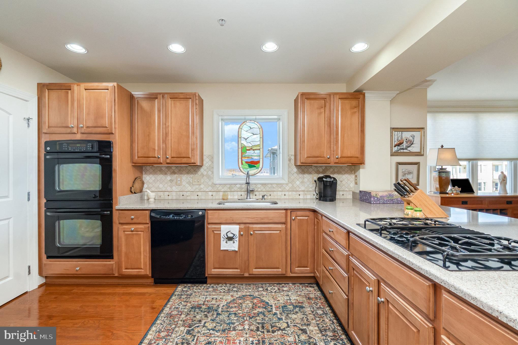 605 Concord Street, Unit 3E Havre de Grace, MD 21078 - Photo 14 of 59 a kitchen with stainless steel appliances granite countertop a stove top oven a sink dishwasher and granite counter tops