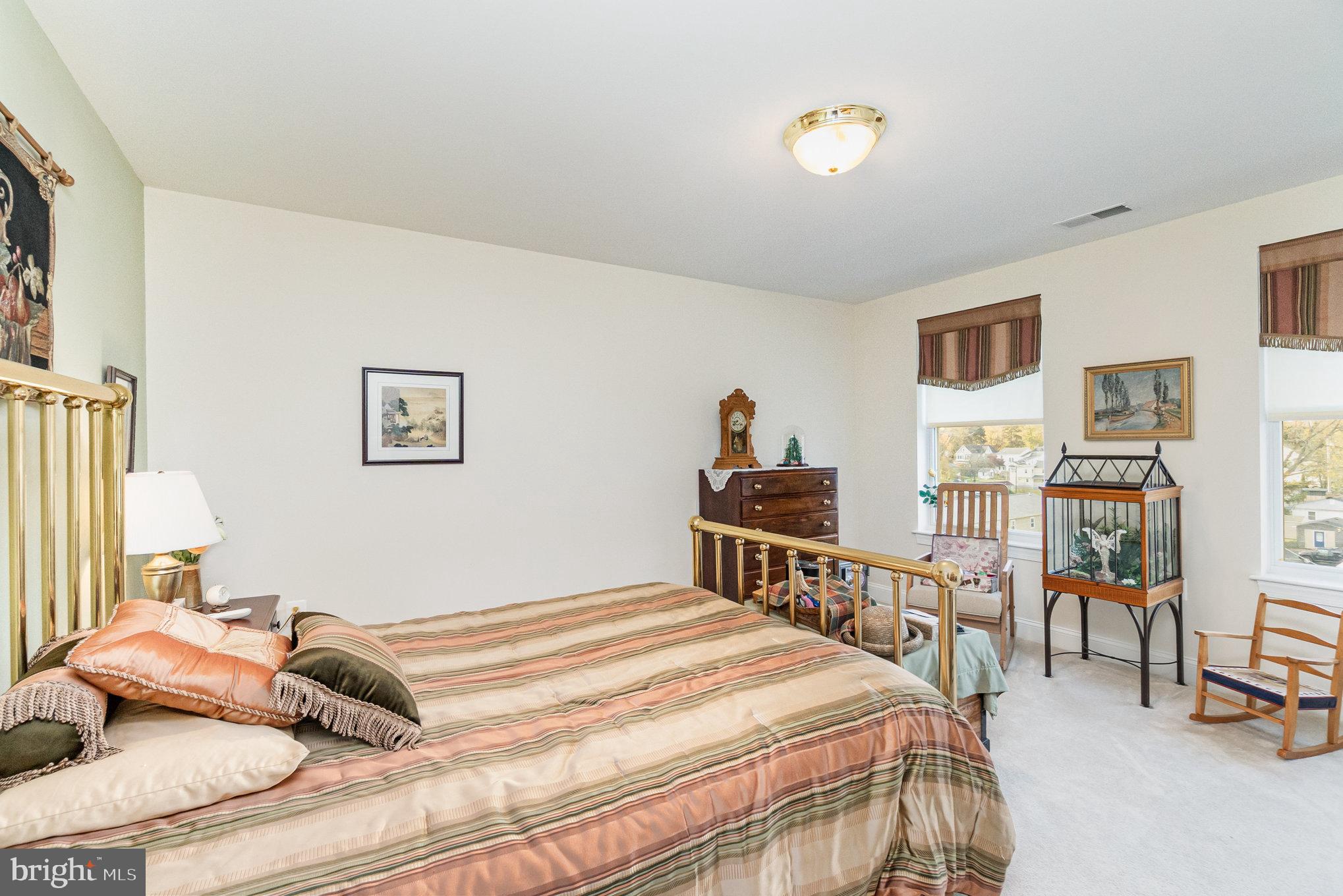 605 Concord Street, Unit 3E Havre de Grace, MD 21078 - Photo 24 of 59 a bedroom with a bed and a chandelier