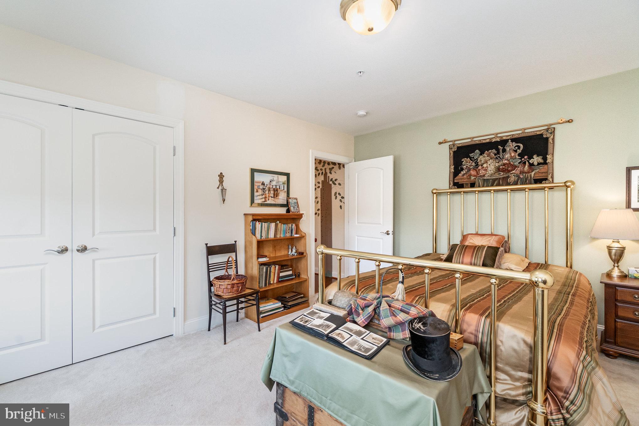 605 Concord Street, Unit 3E Havre de Grace, MD 21078 - Photo 25 of 59 a bedroom with furniture and a book shelf