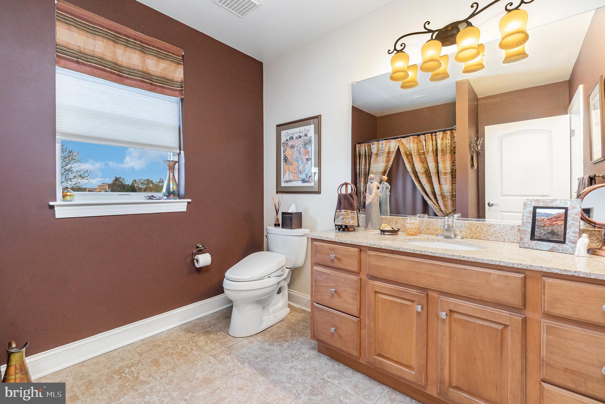 605 Concord Street, Unit 3E Havre de Grace, MD 21078 - Photo 27 of 59 a bathroom with a toilet sink and mirror