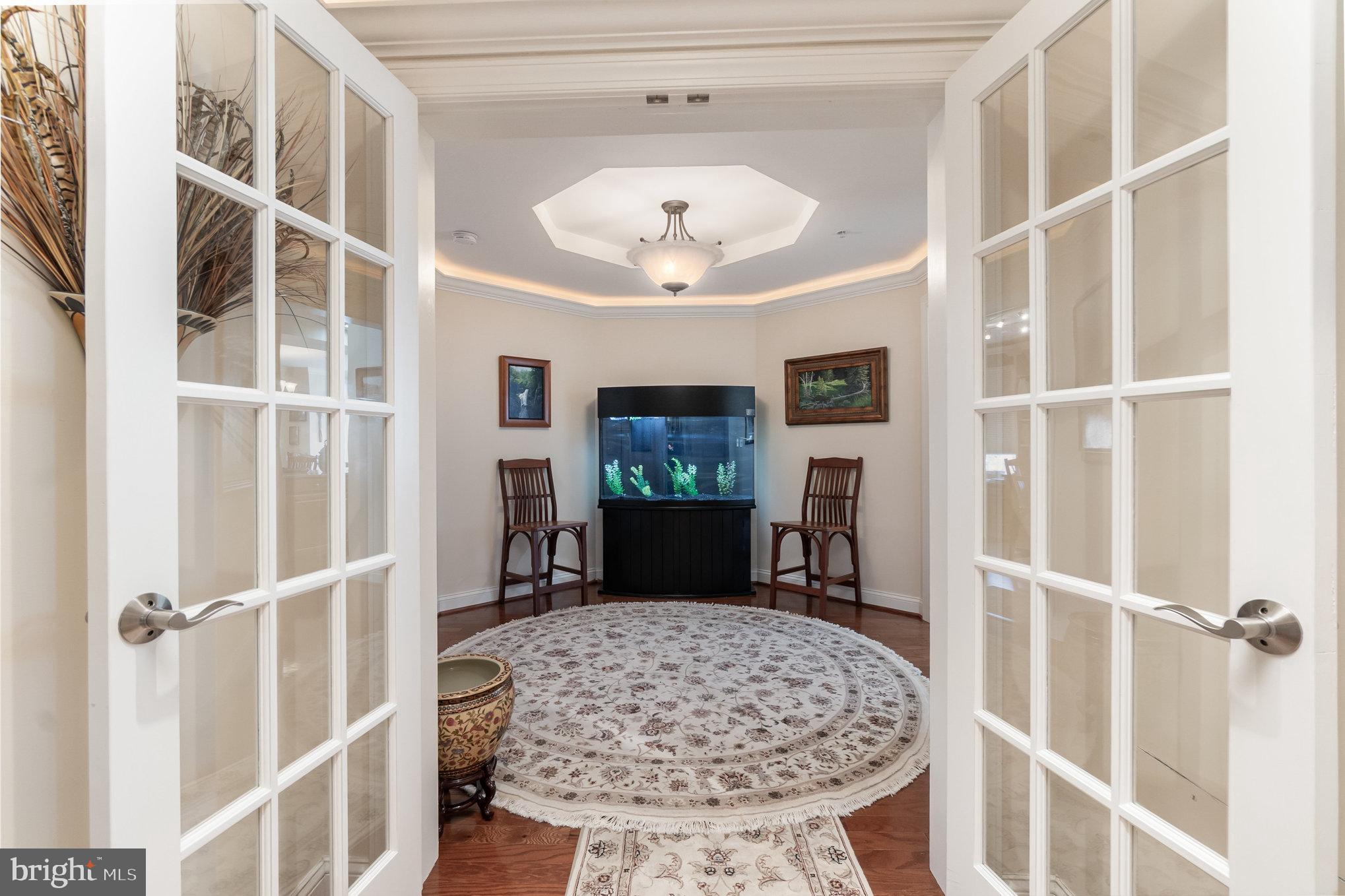 605 Concord Street, Unit 3E Havre de Grace, MD 21078 - Photo 6 of 59 a view of a hallway with a livingroom with furniture and a window