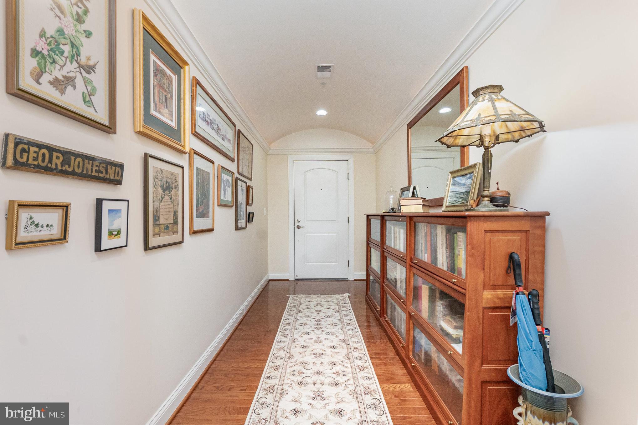 605 Concord Street, Unit 3E Havre de Grace, MD 21078 - Photo 7 of 59 a view of a hallway to a house with wooden floor