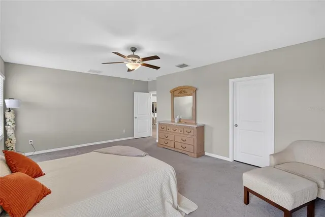 a en suite bathroom with a double vanity sink and a mirror