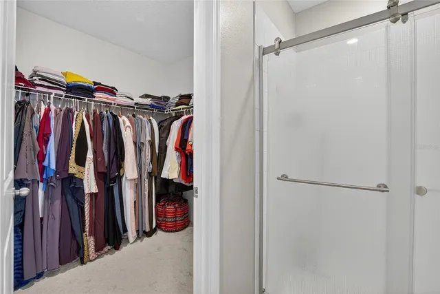 a kitchen with a sink and white cabinets