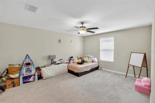 a bedroom with a bed and furniture