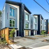 a view of a brick building with many windows