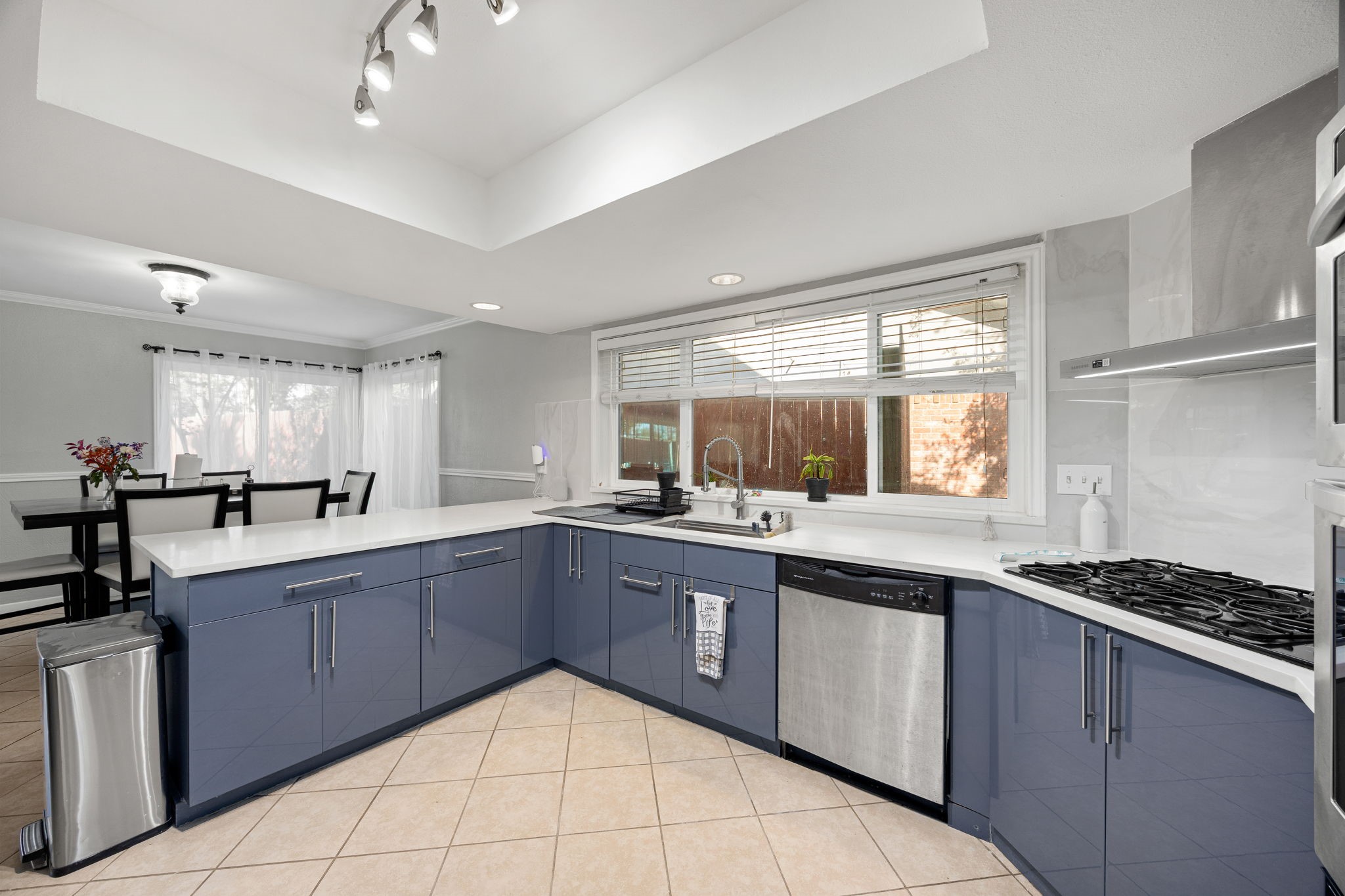 9907 Gold Cup Way Houston, TX 77065 - Photo 13 of 39 a kitchen with a sink stove and cabinets
