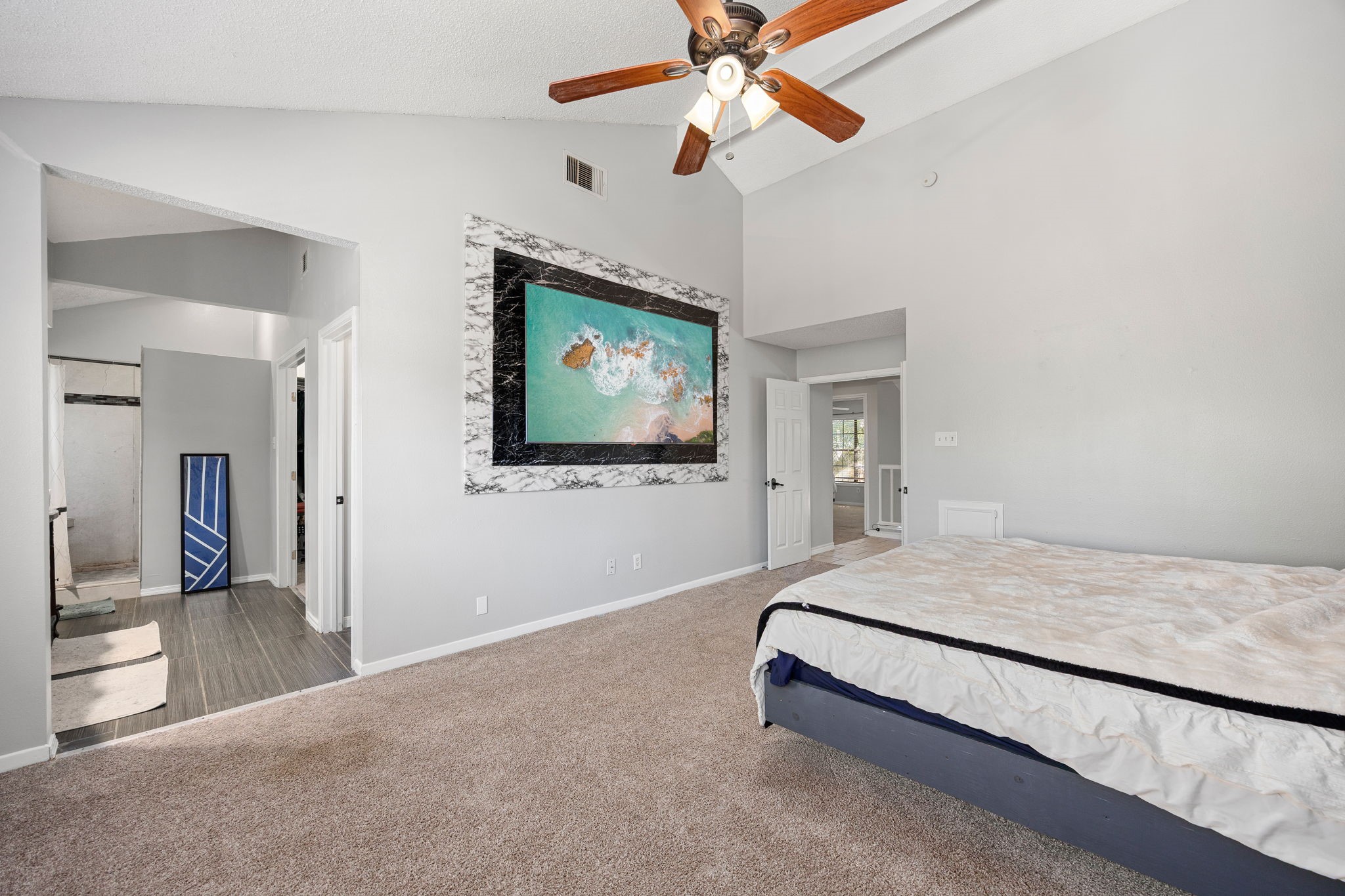 9907 Gold Cup Way Houston, TX 77065 - Photo 20 of 39 a bedroom with a bed and a flat screen tv