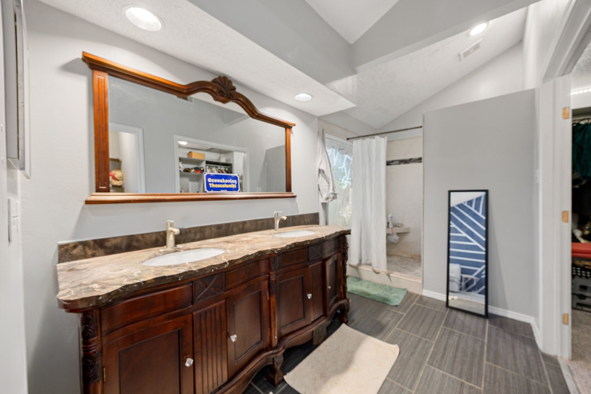 9907 Gold Cup Way Houston, TX 77065 - Photo 21 of 39 a bathroom with a granite countertop double vanity sink and mirror
