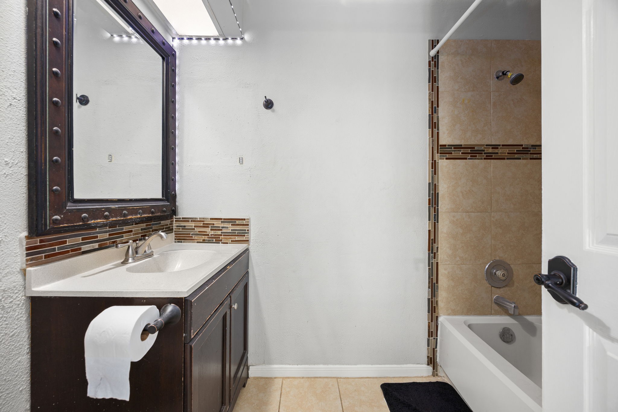 9907 Gold Cup Way Houston, TX 77065 - Photo 26 of 39 a bathroom with a sink and a mirror