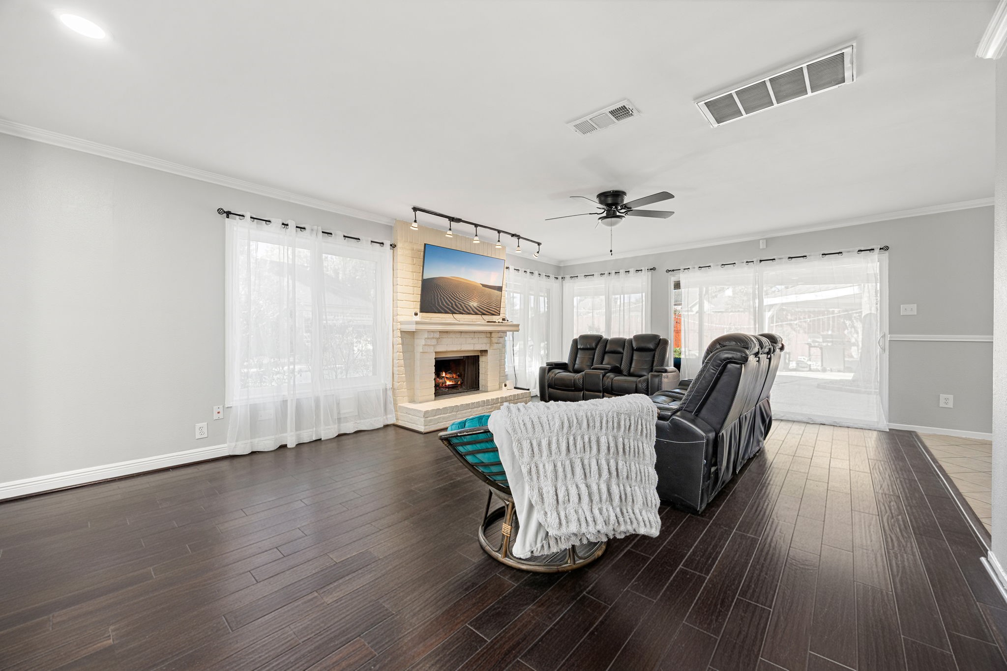 9907 Gold Cup Way Houston, TX 77065 - Photo 5 of 39 a living room with furniture and a fireplace