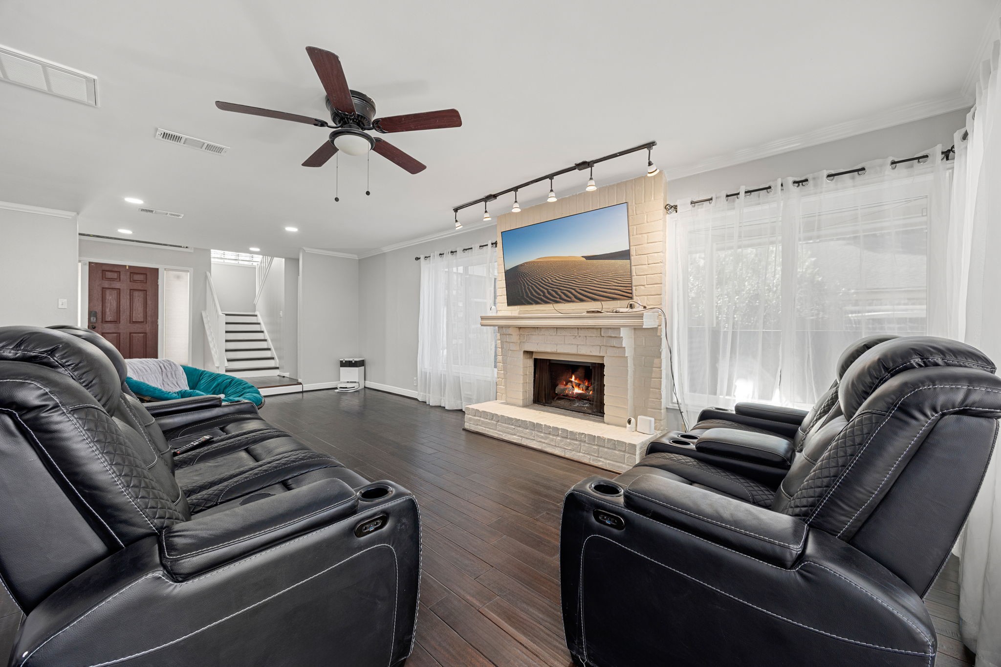 9907 Gold Cup Way Houston, TX 77065 - Photo 6 of 39 a living room with furniture and a fireplace