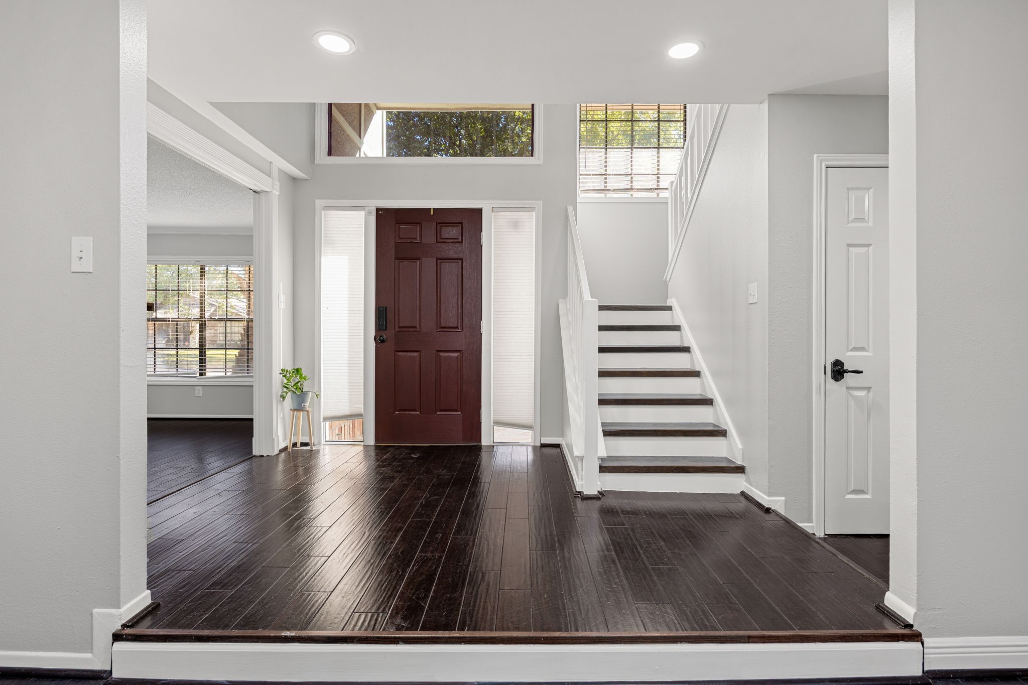 9907 Gold Cup Way Houston, TX 77065 - Photo 8 of 39 an empty room with wooden floor and windows