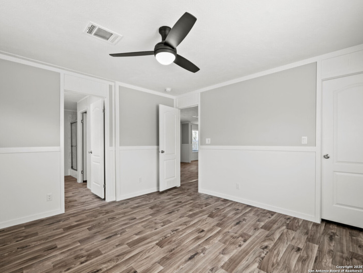 1144 Turkey Canyon Drive Spring Branch, TX 78070 - Photo 18 of 23 a view of empty room with wooden floor