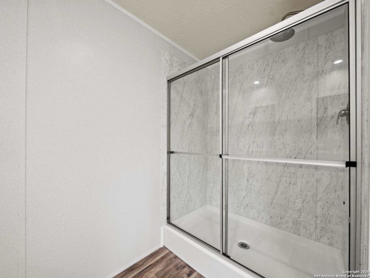 1144 Turkey Canyon Drive Spring Branch, TX 78070 - Photo 20 of 23 a bathroom with a glass shower door