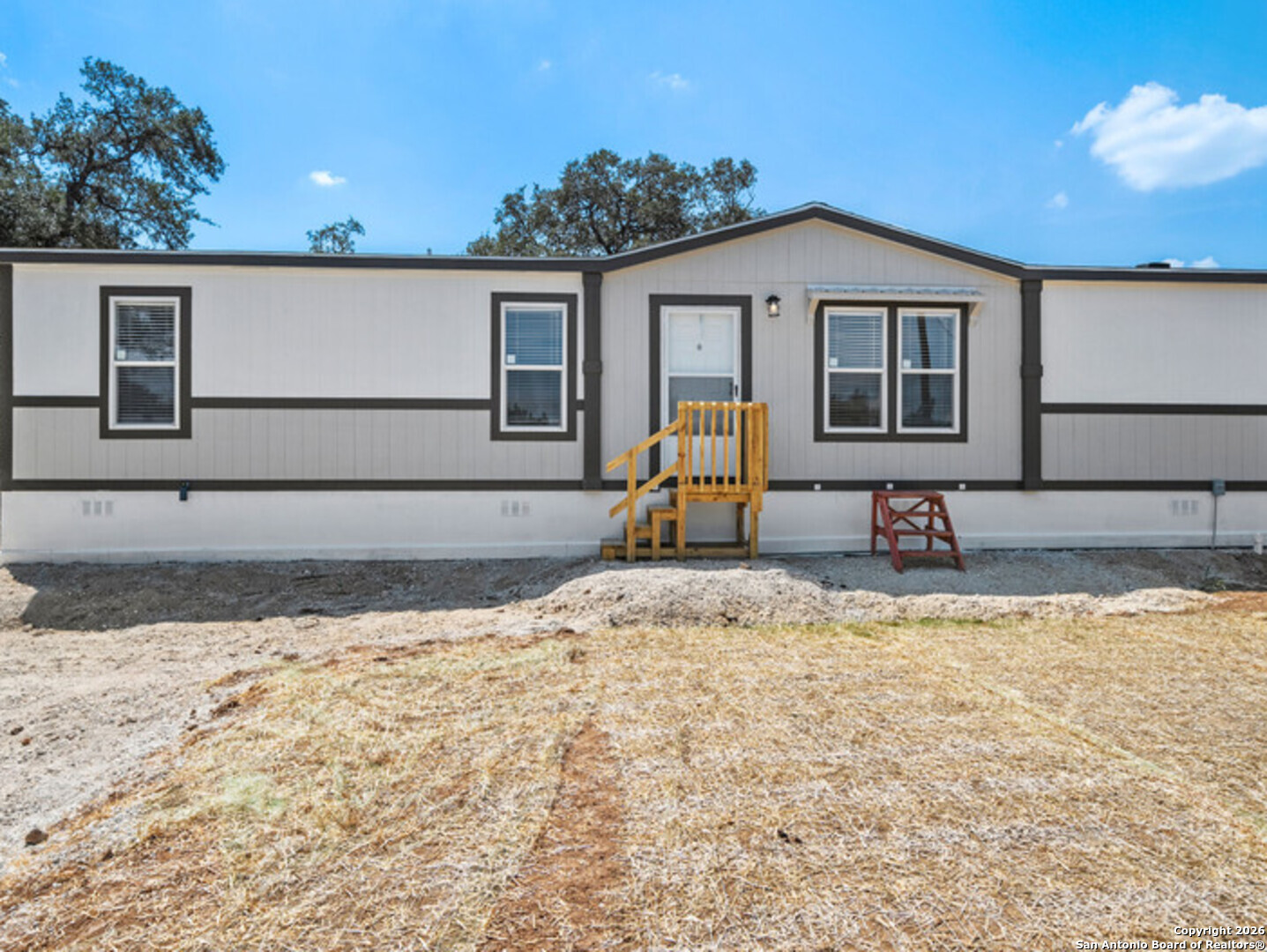 1144 Turkey Canyon Drive Spring Branch, TX 78070 - Photo 2 of 23 a view of a house with backyard and sitting area