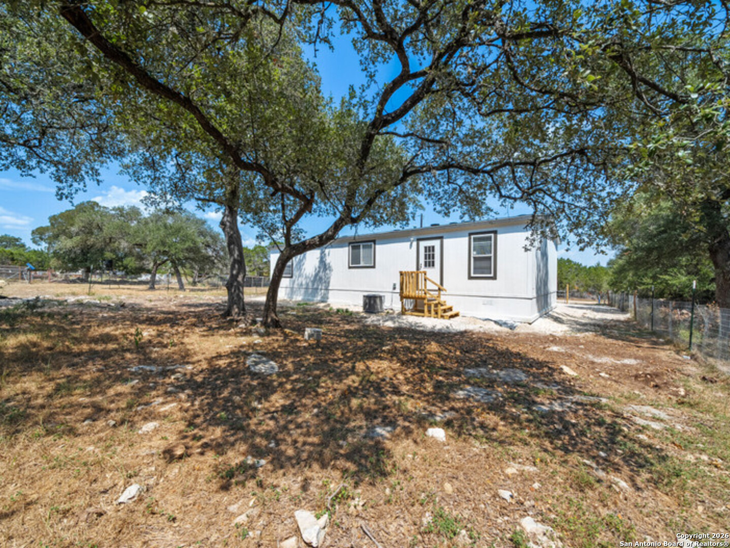 1144 Turkey Canyon Drive Spring Branch, TX 78070 - Photo 23 of 23 a view of a house with a yard
