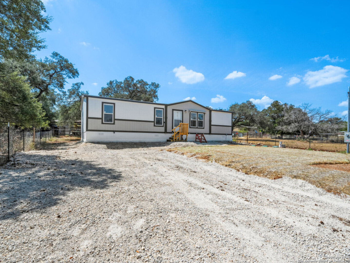 1144 Turkey Canyon Drive Spring Branch, TX 78070 - Photo 4 of 23 a front view of a house with a yard