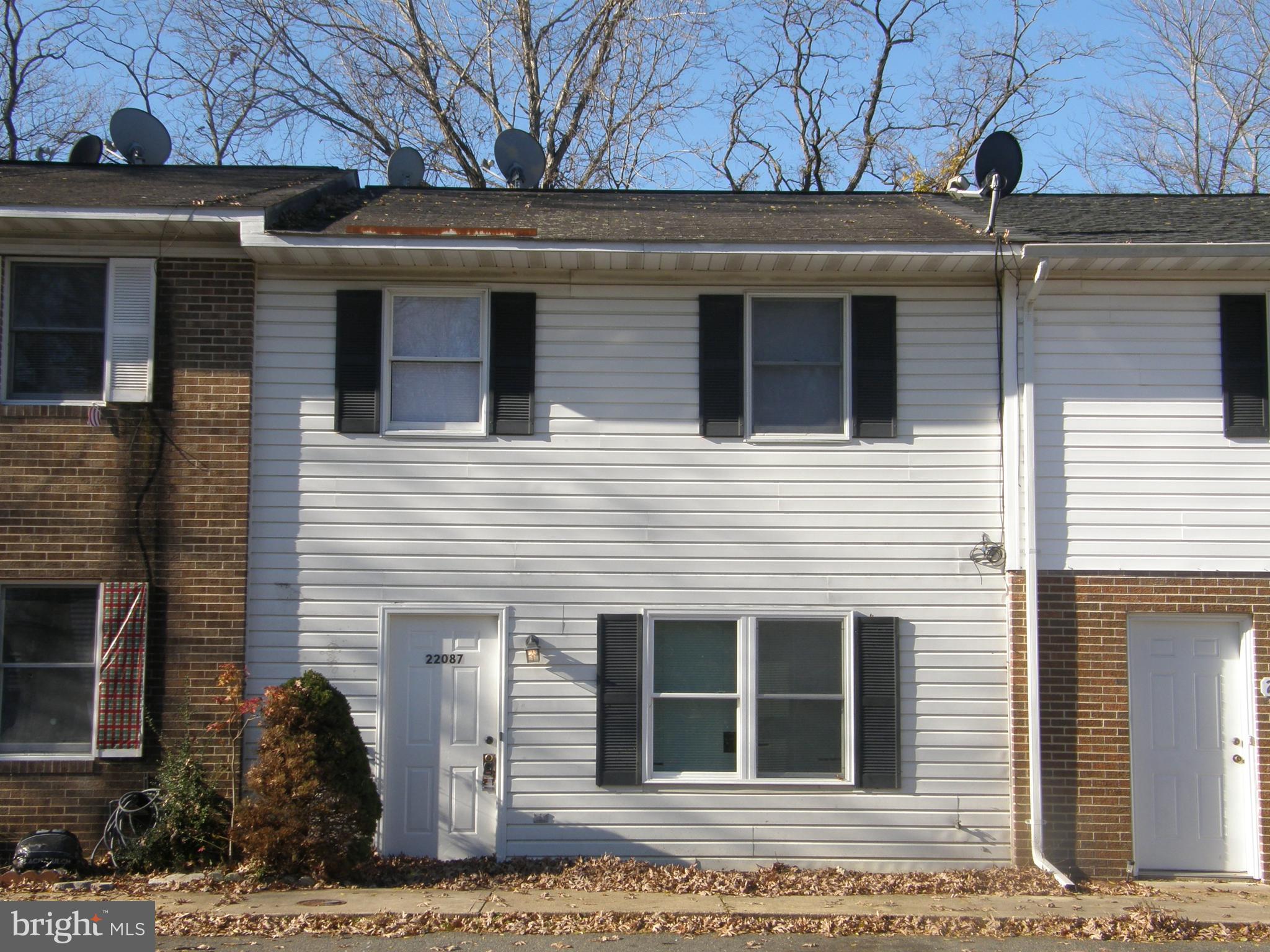 a view of a house with a door and a window