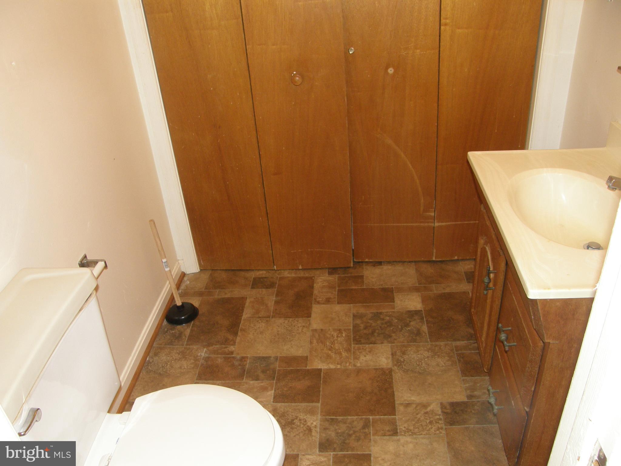 22087 Spring Valley Drive Lexington Park, MD 20653 - Photo 11 of 29 a bathroom with a sink and a mirror