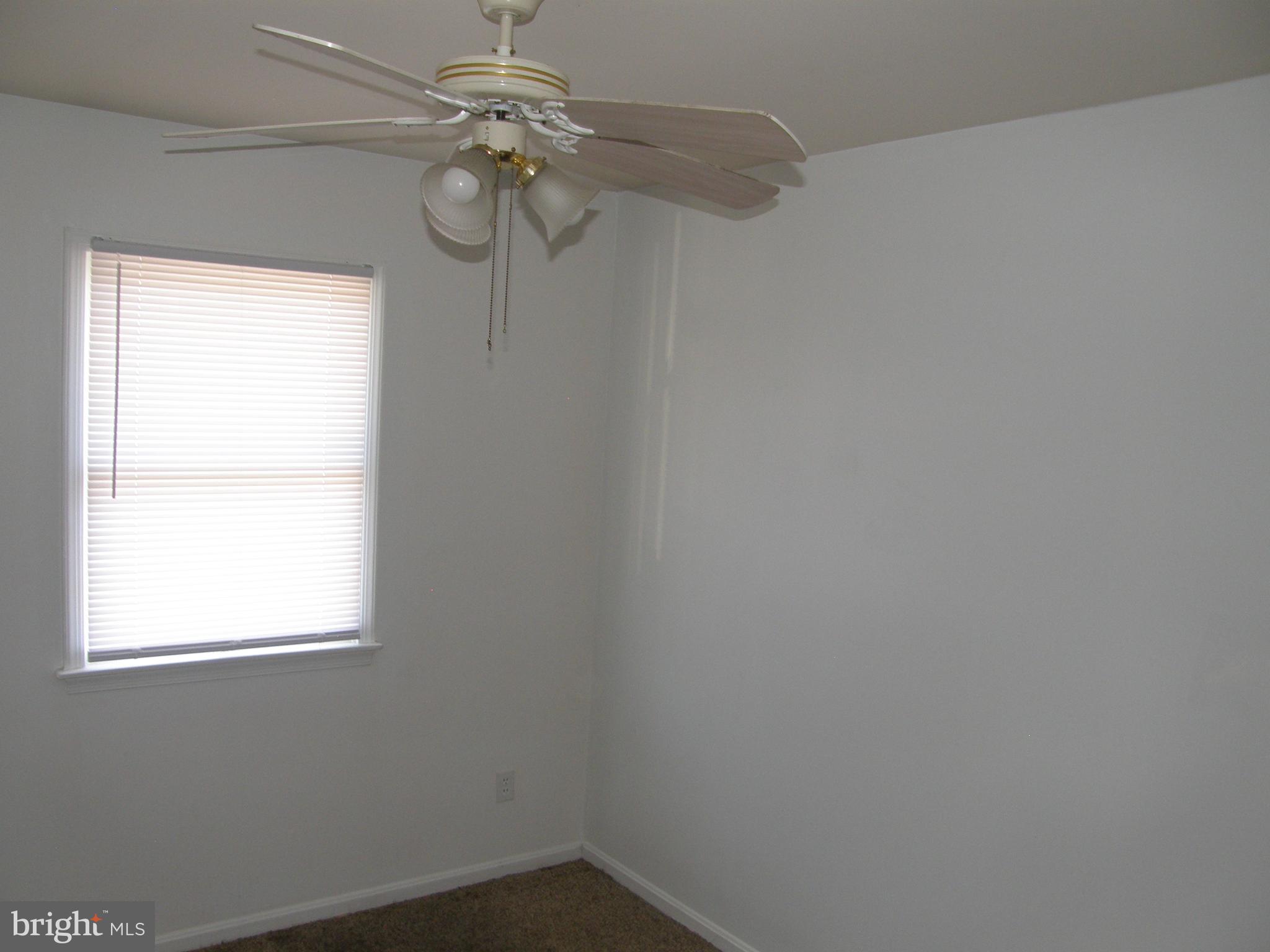 22087 Spring Valley Drive Lexington Park, MD 20653 - Photo 22 of 29 a small space with a window and a chandelier fan