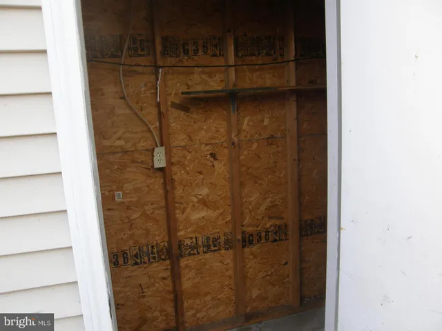a view of a brick house with many windows