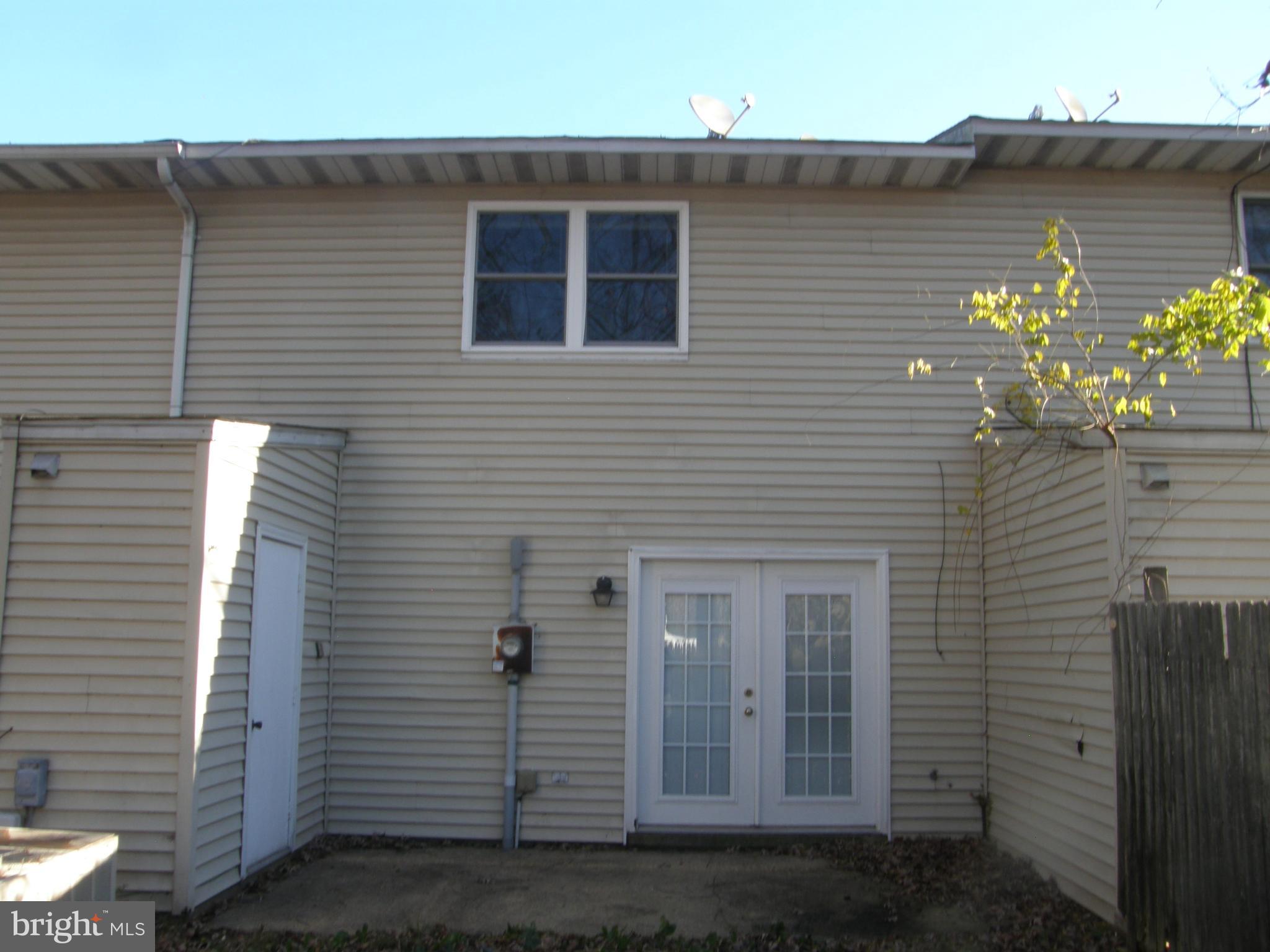 22087 Spring Valley Drive Lexington Park, MD 20653 - Photo 29 of 29 a view of a brick house with many windows