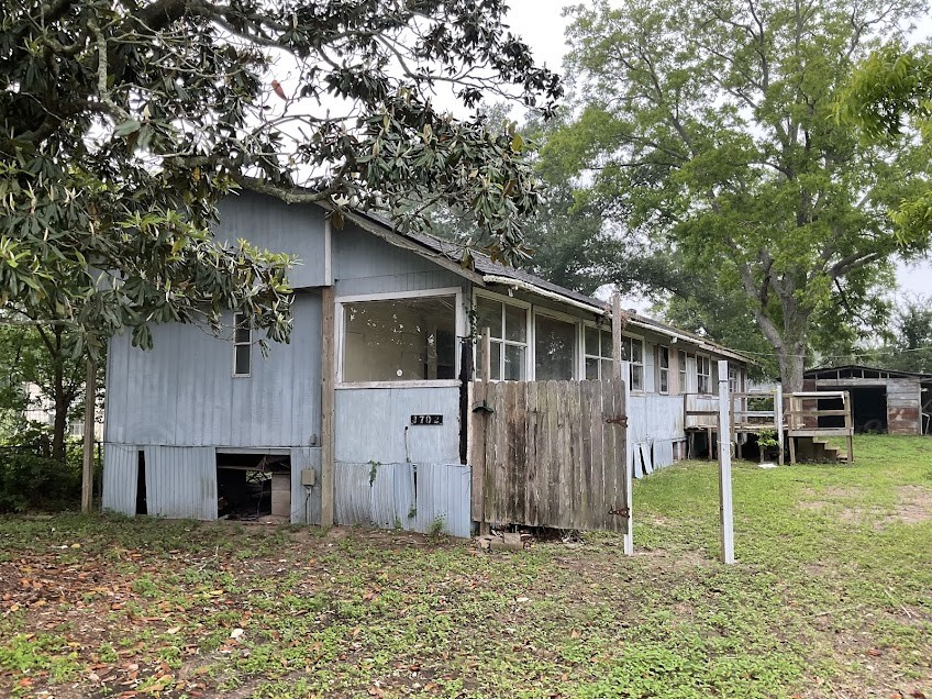3702 Park Street Damon, TX 77430 - Photo 1 of 12 a backyard of a house with lots of green space
