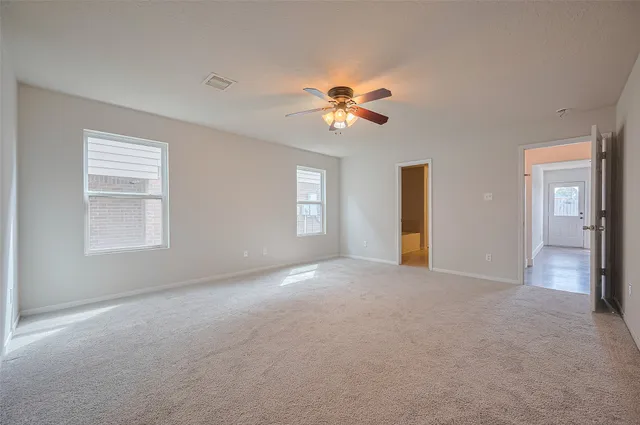 a view of empty room with windows