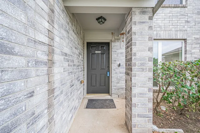 a view of a brick house with a door