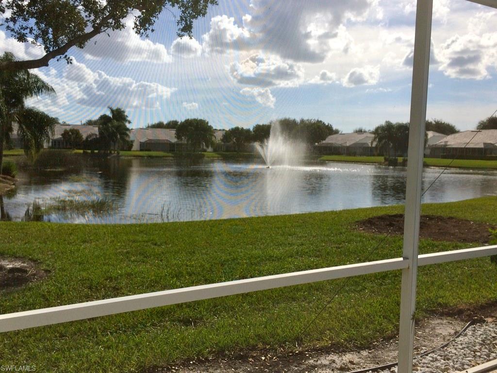 2258 Stacil Circle, Unit 1 Naples, FL 34109 - Photo 21 of 28 a view of a lake from a yard