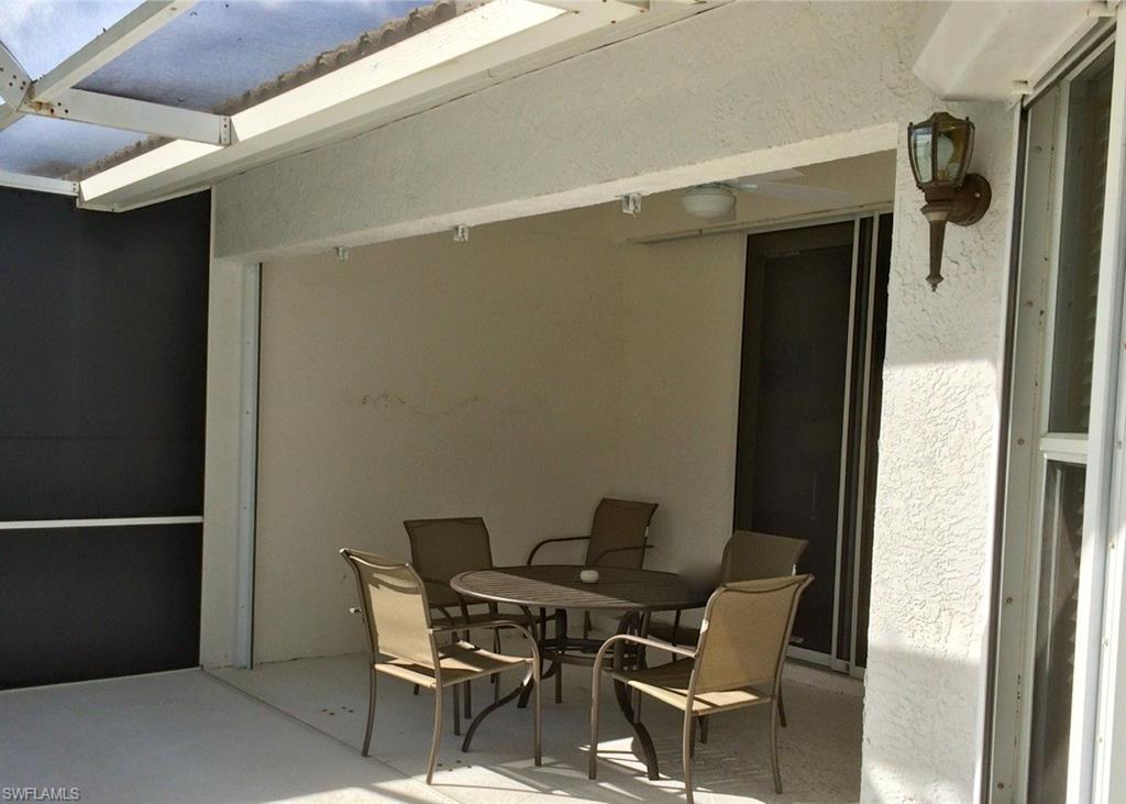 2258 Stacil Circle, Unit 1 Naples, FL 34109 - Photo 26 of 28 a view of a outdoor space with seating area