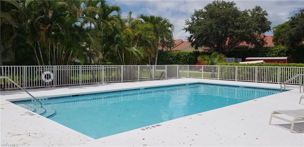 2258 Stacil Circle, Unit 1 Naples, FL 34109 - Photo 27 of 28 a view of a swimming pool with a backyard