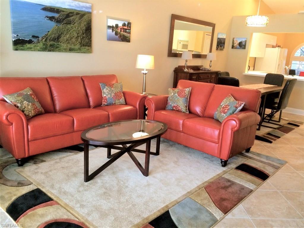 2258 Stacil Circle, Unit 1 Naples, FL 34109 - Photo 5 of 28 a living room with furniture and a couch