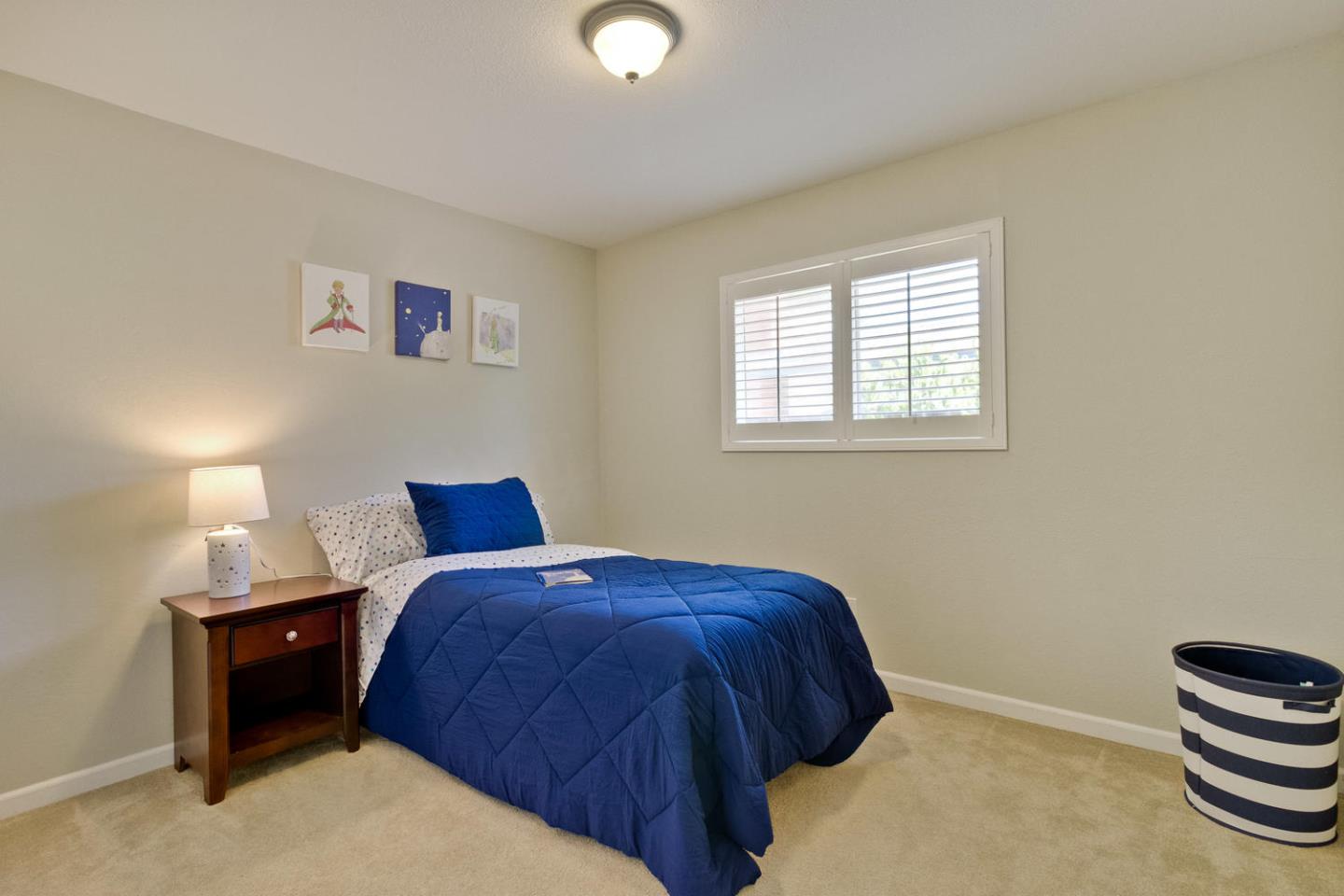 1101 Kenwal Road Concord, CA 94521 - Photo 14 of 20 a bedroom with a bed and a window
