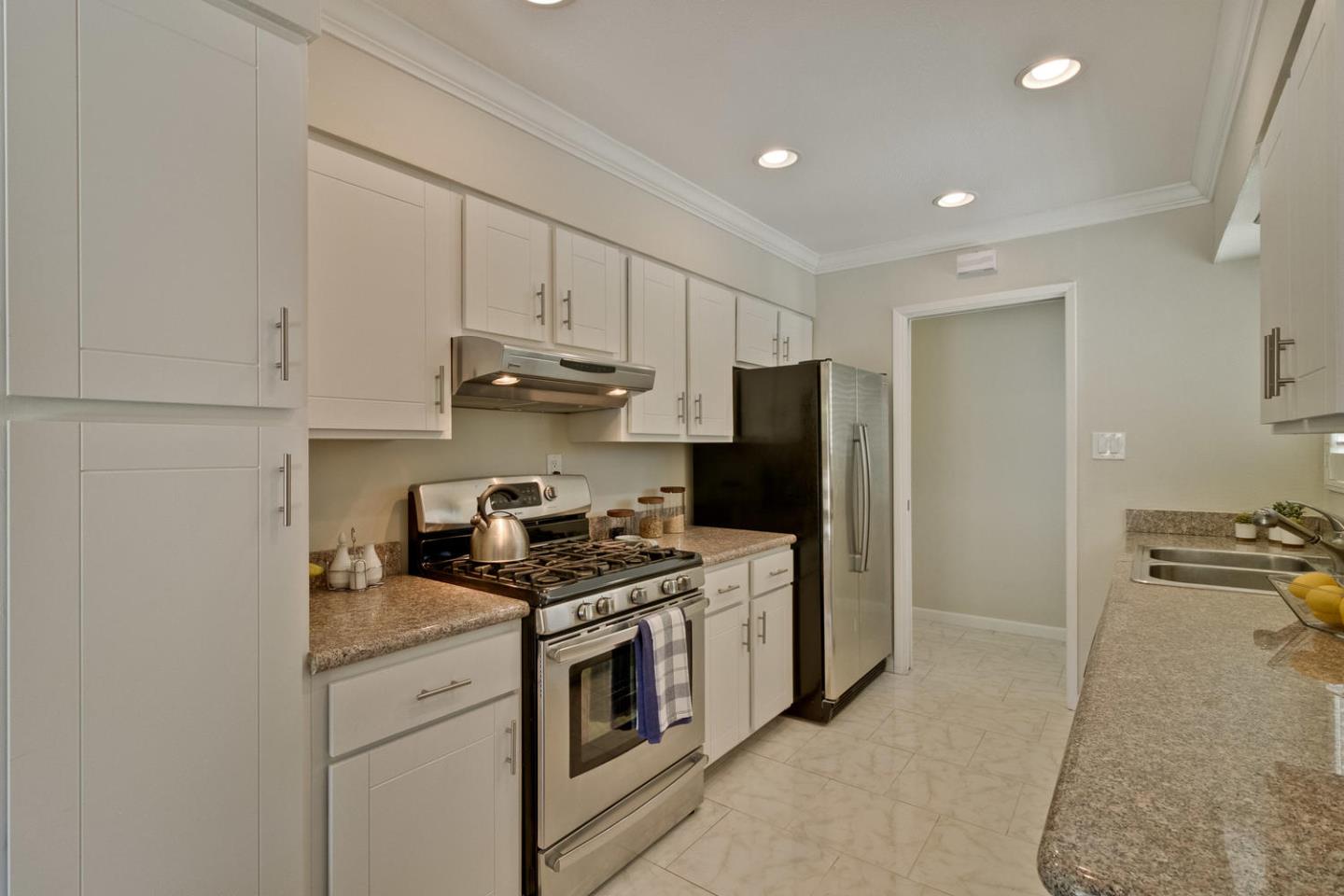 1101 Kenwal Road Concord, CA 94521 - Photo 9 of 20 a kitchen with stainless steel appliances granite countertop a stove a refrigerator and a sink