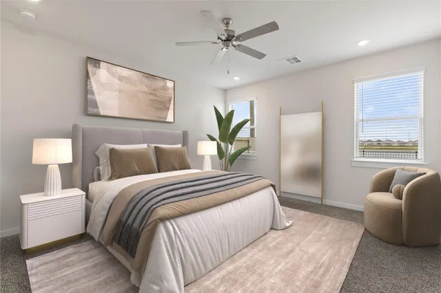 a bedroom with a bed and a couch