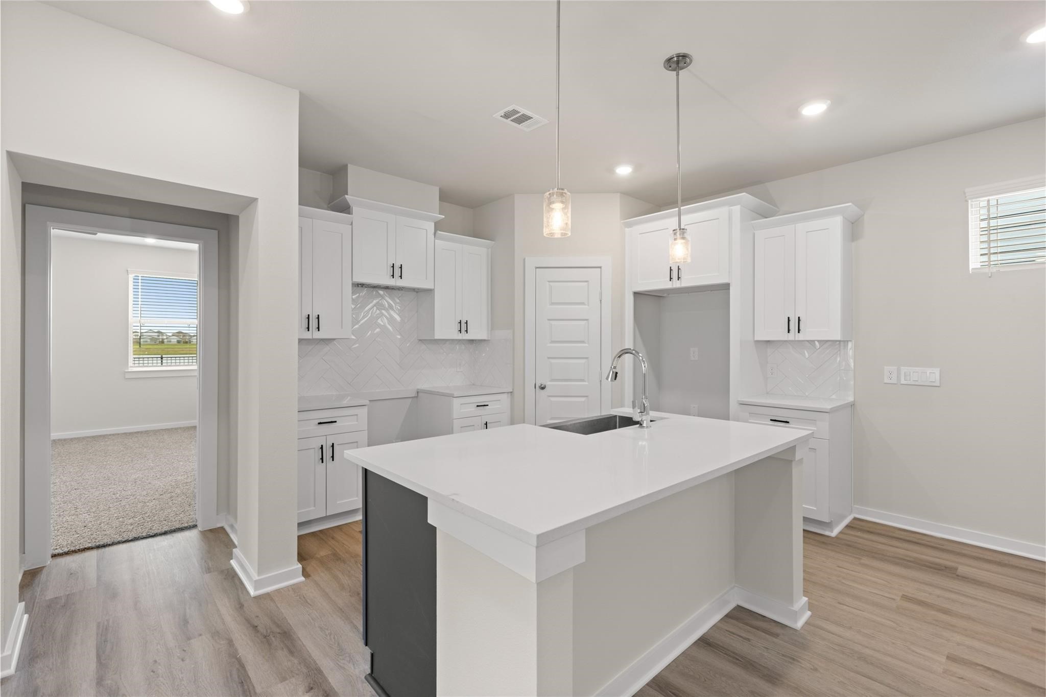 1222 Elsinore Drive Rosharon, TX 77583 - Photo 5 of 25 Cozy kitchen, with a stylish two toned island.